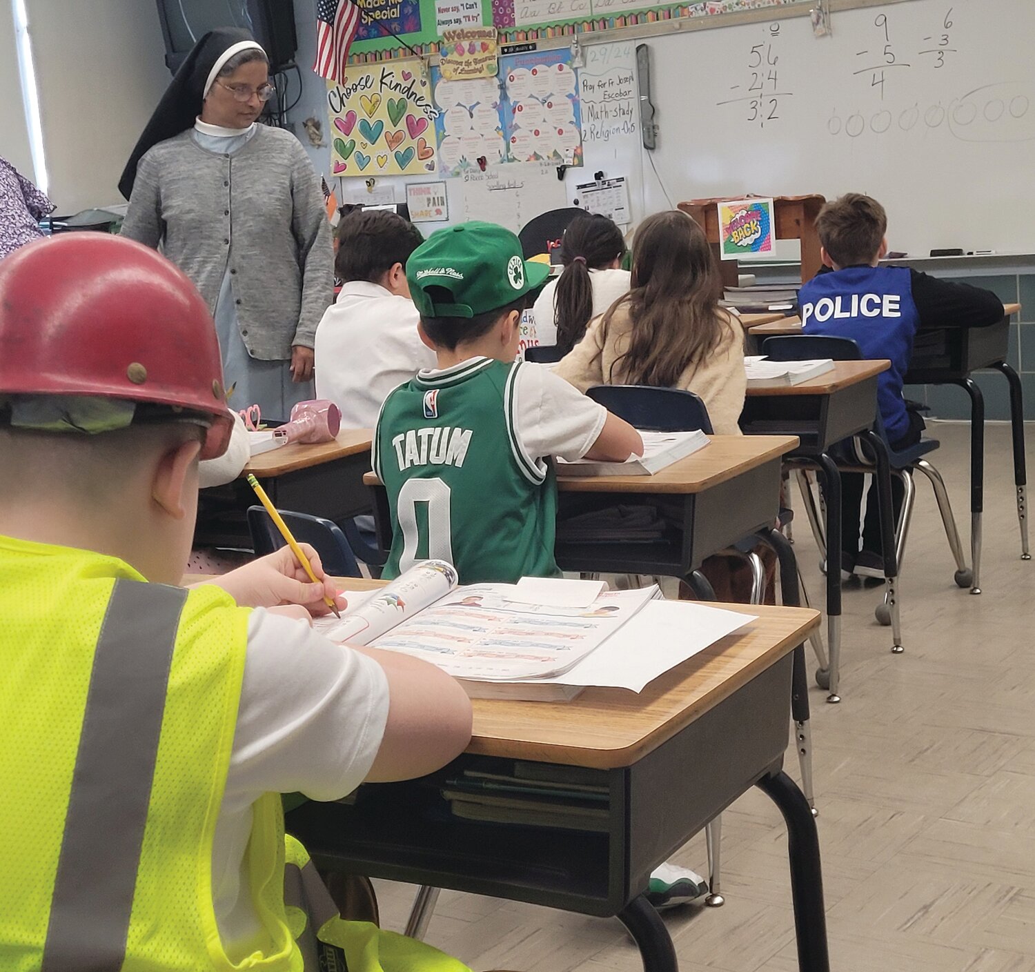WHEN THEY GROW UP: Students in Sister Daisy Kollamparampil’s second-grade class were dressed as their possible future vocations during Career Day on Monday. Sr. Daisy returned to the job on Jan. 10, more than two months after she was seriously injured in the crosswalk outside the school.
